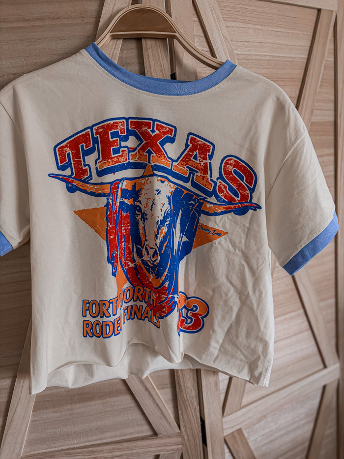 Vintage-style t-shirt with 'Texas Fort Worth Rodeo Finals' design on a wooden hanger.